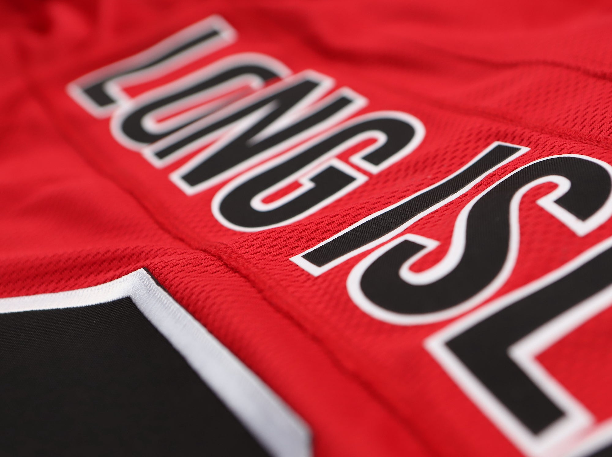 Long Island Ducks 1965-66 Jersey (CUSTOM - PRE-ORDER) in red with vintage hockey style and bold lettering close-up view